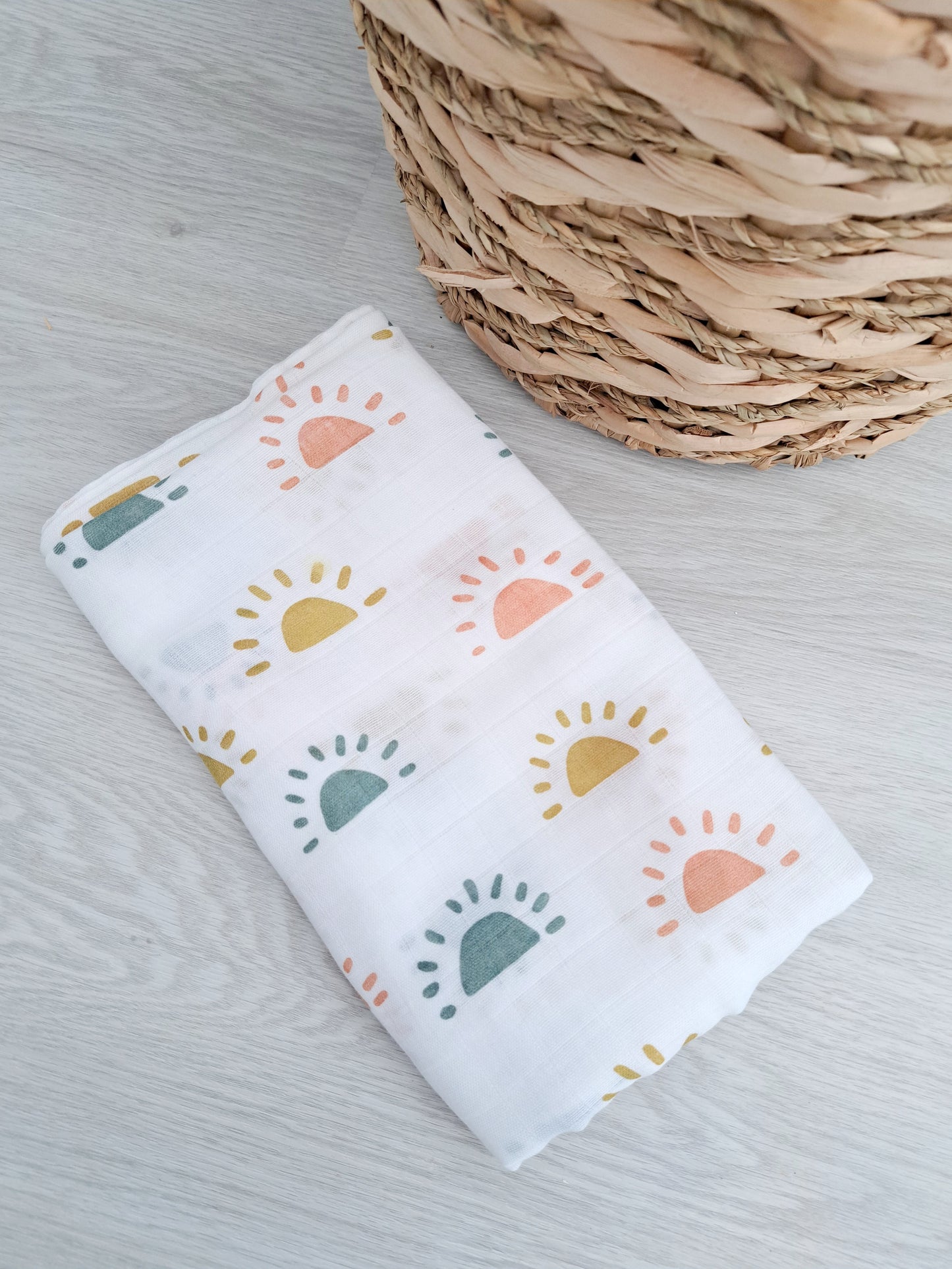 Folded Skandi rainbow muslin showing modern rainbow pattern