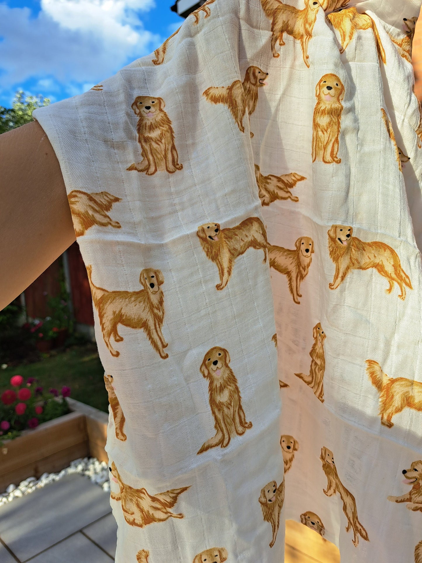Close-up of soft organic cotton golden retriever print muslin