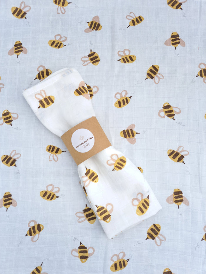 Bumblebee and honeycomb print organic cotton muslin square or swaddle with yellow design