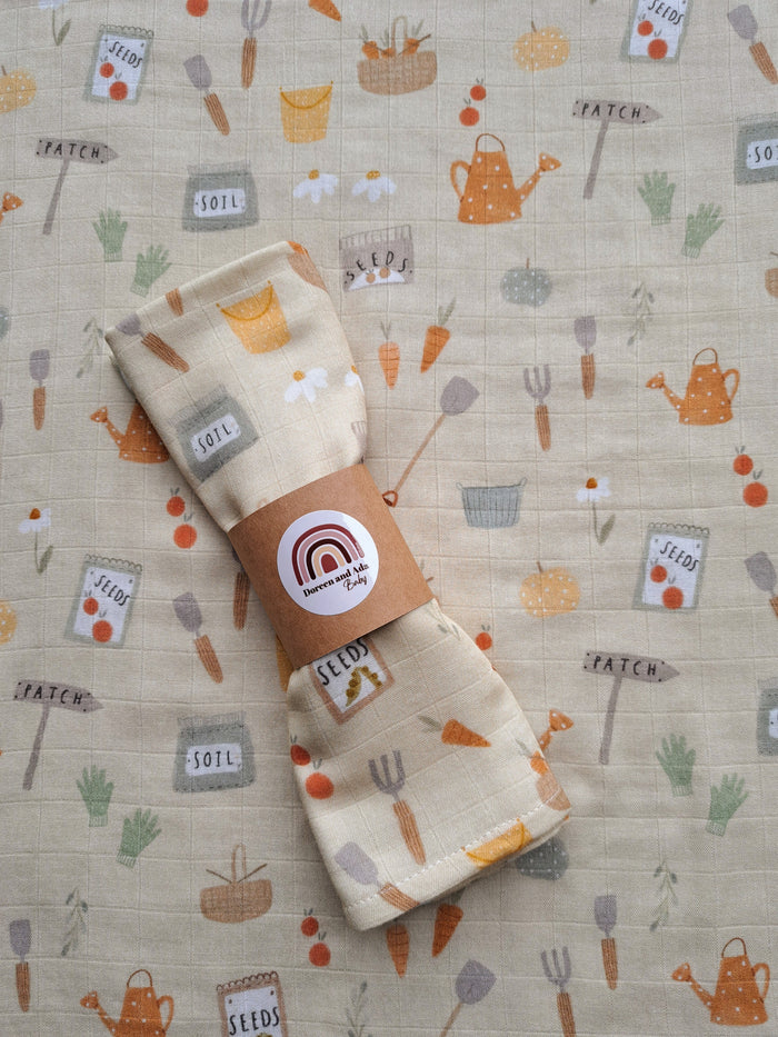 Garden and allotments print organic cotton muslin square with vegetable patch design