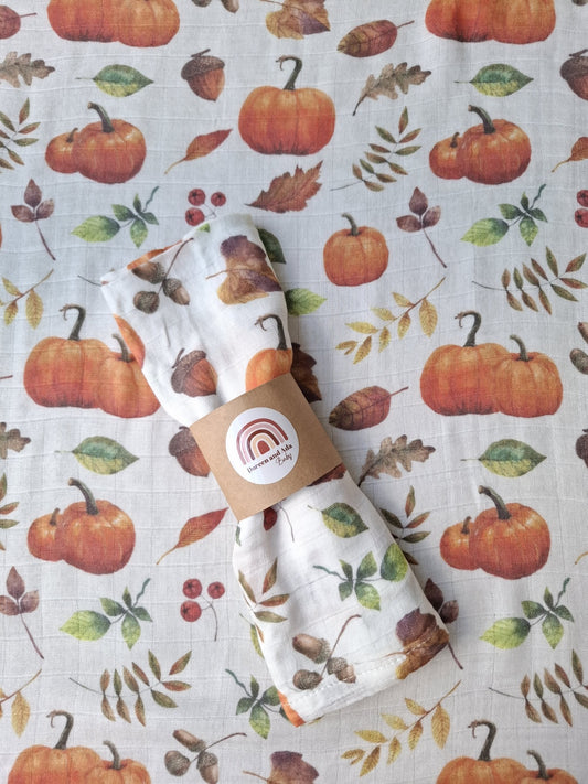 Autumn Harvest muslin square with pumpkins, acorns and autumn leaves pattern