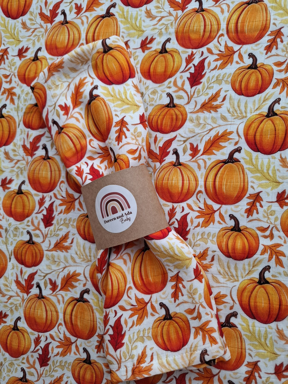 Rolled muslin square with autumn pumpkin design