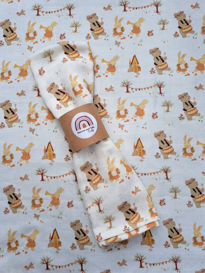 Musical bears and rabbits print organic cotton muslin square with instruments design