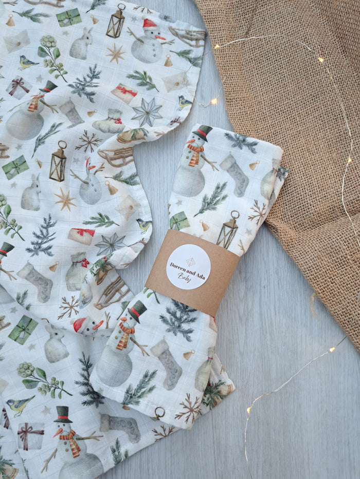 Christmas snowman and presents print organic cotton muslin square with festive holiday design