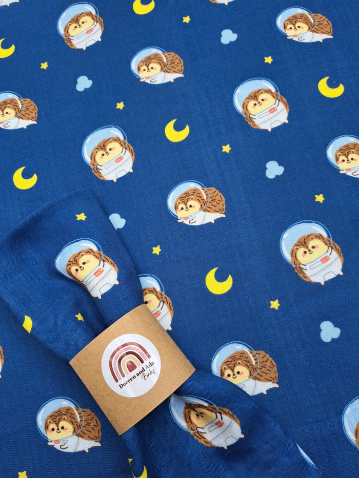 Space hedgehog print organic cotton muslin square with astronaut animal design for babies