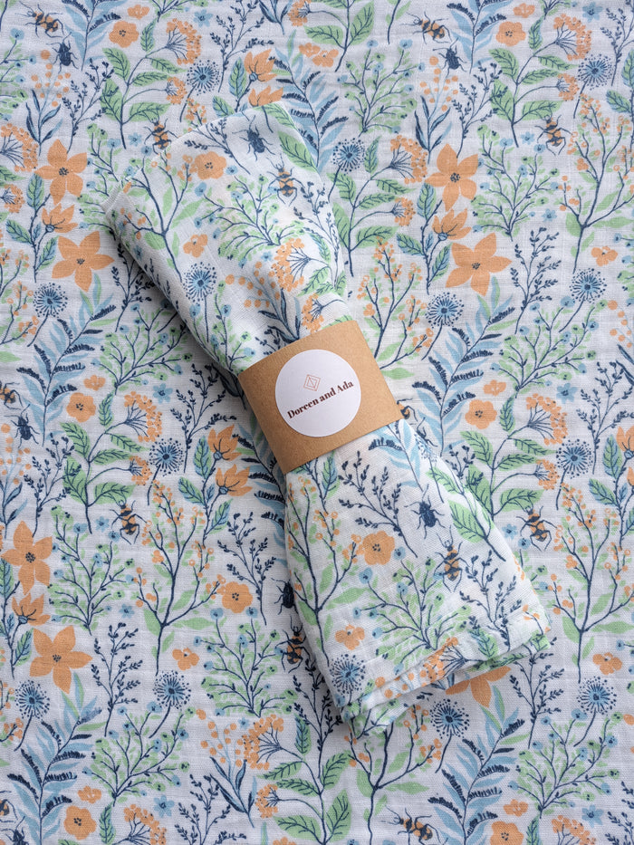 Wildflower meadow and bees print organic cotton muslin square with botanical garden design