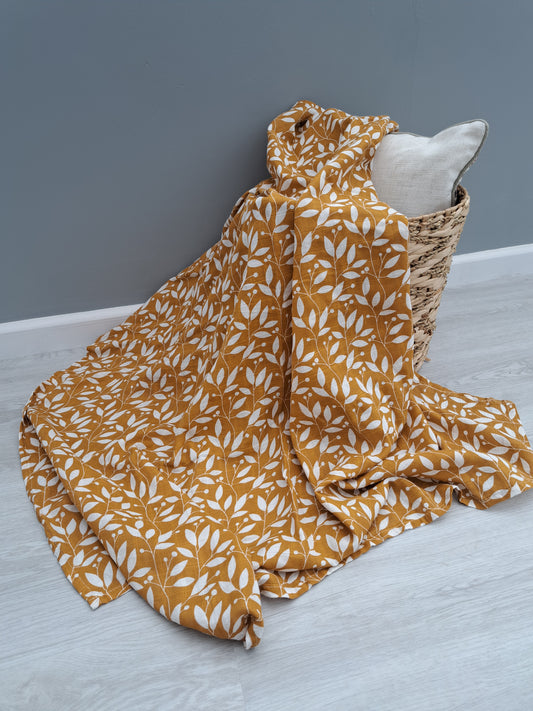 Rust Leaf Muslin Swaddle by Doreen and Ada