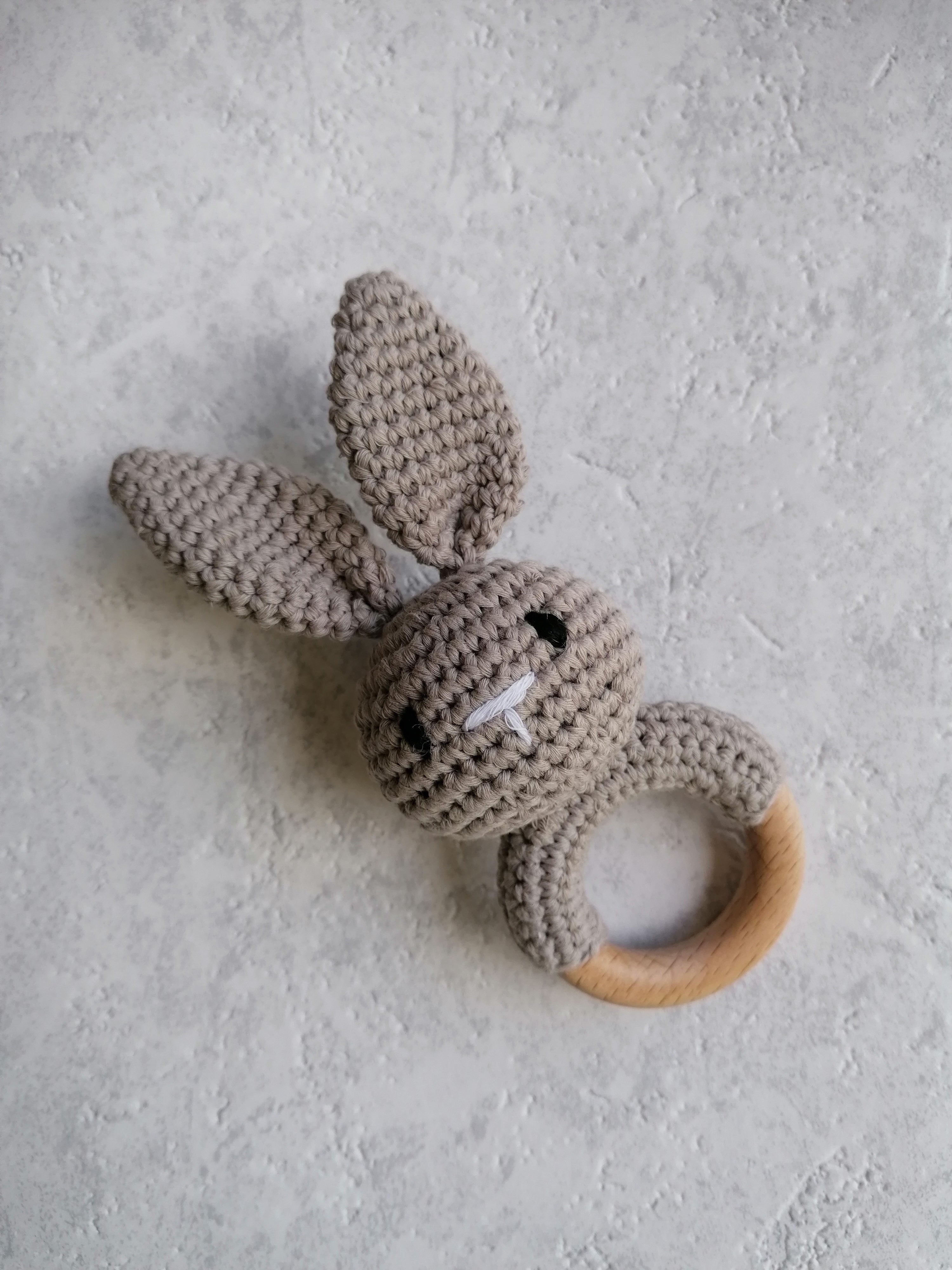 Grey knitted bunny teether rattle with long ears and natural beech wood ring
