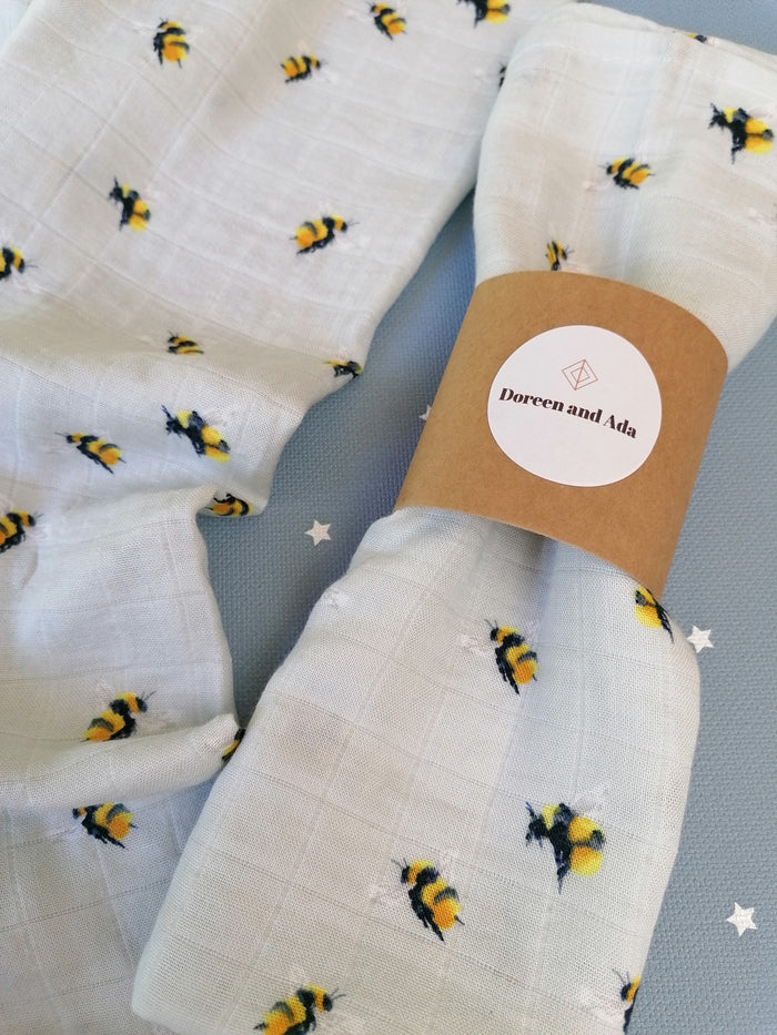 Bumblebee and honeycomb print organic cotton muslin square with yellow and black design